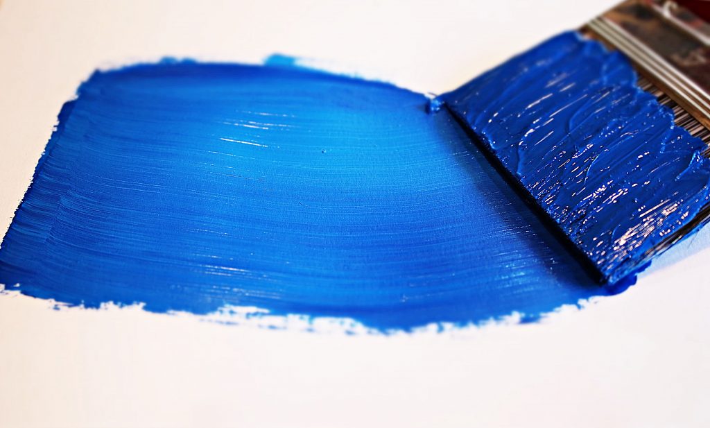 Paint brush leaving a blue streak, one of the paint colors that repel insects