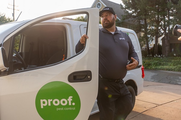 proof. technician exiting his van saying "proof." in a green circle with white text 