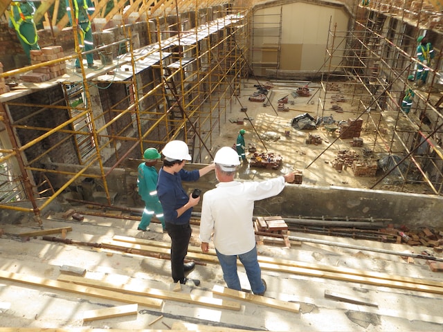 Two men surveying a construction site