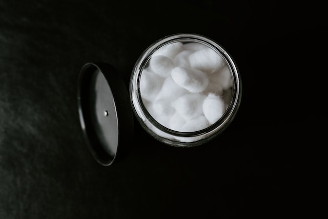 White cotton balls in a glass jar