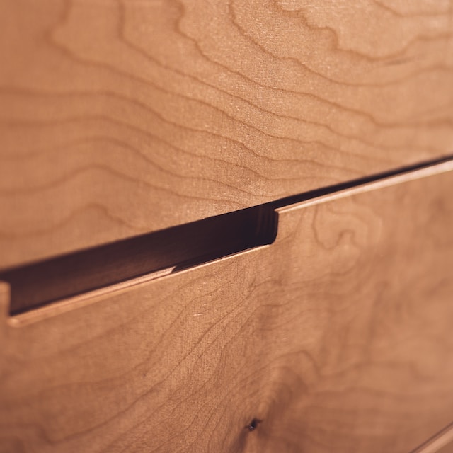 Macro image of a brown wooden beside drawer