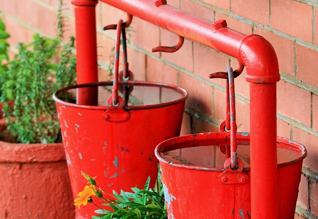 Red water pails hanging 